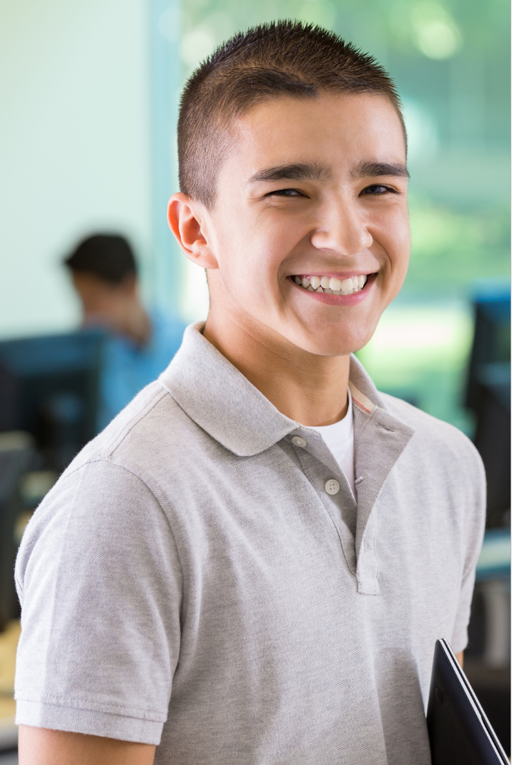 Young man smiling and posing at school